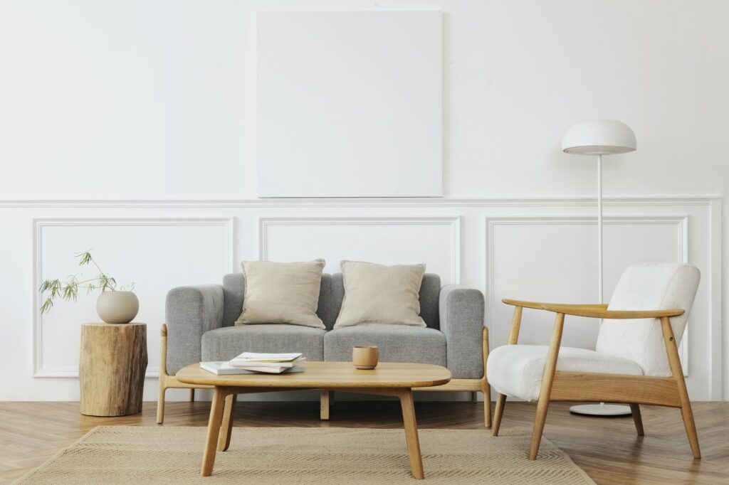 Scandinavian style living room with a grey sofa and panelled wall